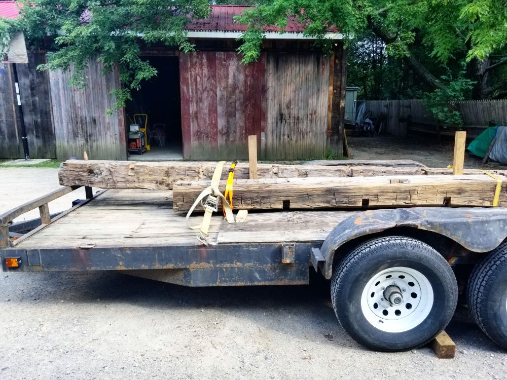 A few beams loaded on a trailer.